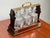 This wonderful antique English Edwardian tantalus dates to the early 20th century and is a beautiful example of the...