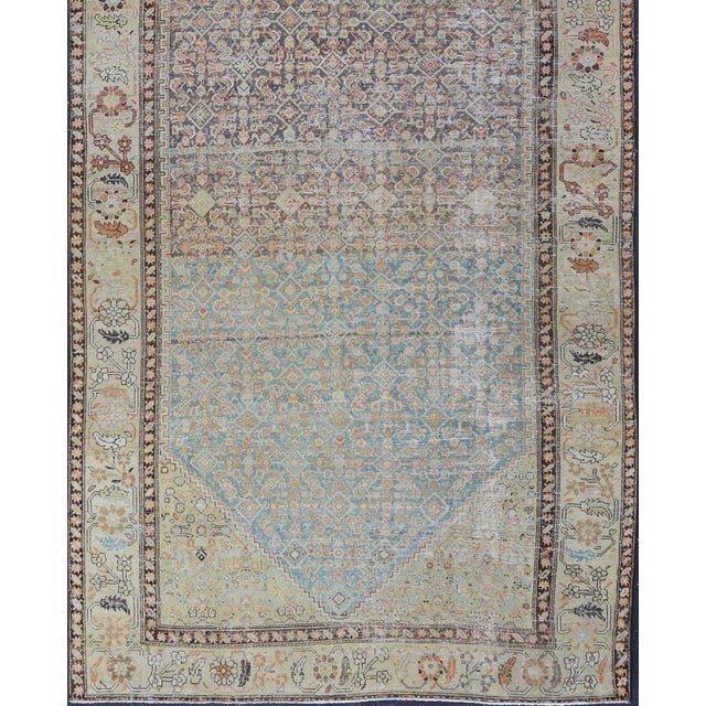This antique Malayer is a beautiful piece displays a large medallion in the field, filled and surrounded by many motifs,...