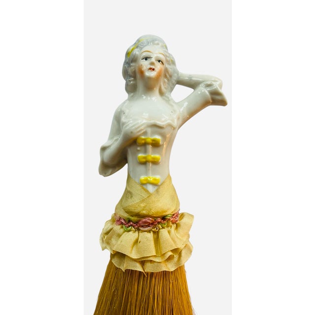 This is a clothes brush for your 1920s boudoir. Made in Germany during the 20s, it depicts an 18th century ceramic lady on...