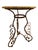 Gorgeous travertine top accent table atop curved and wrought iron with a bronzed finish. Elegant and versatile, a table...