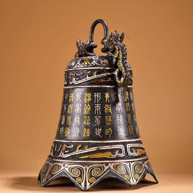 This is a striking vintage Chinese bronze bell (Zhong) featuring intricate gold and silver inlay (cuo jin yin). The piece...