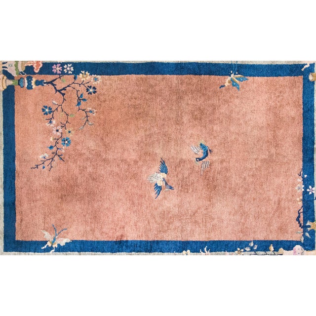 A captivating early 20th-century Chinese Art Deco rug, this piece is a masterful blend of symbolism and color. The soft...