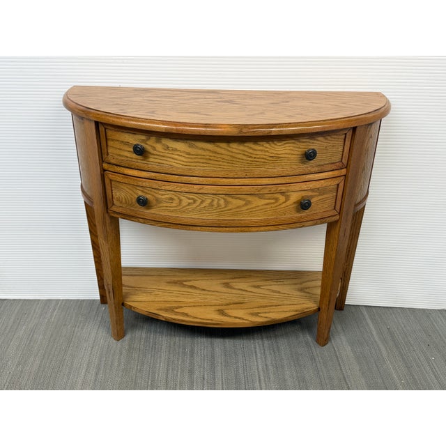 Design Plus Gallery presents the Newport Demi-lune Table From Ballard Designs. This classic half-moon console table is...