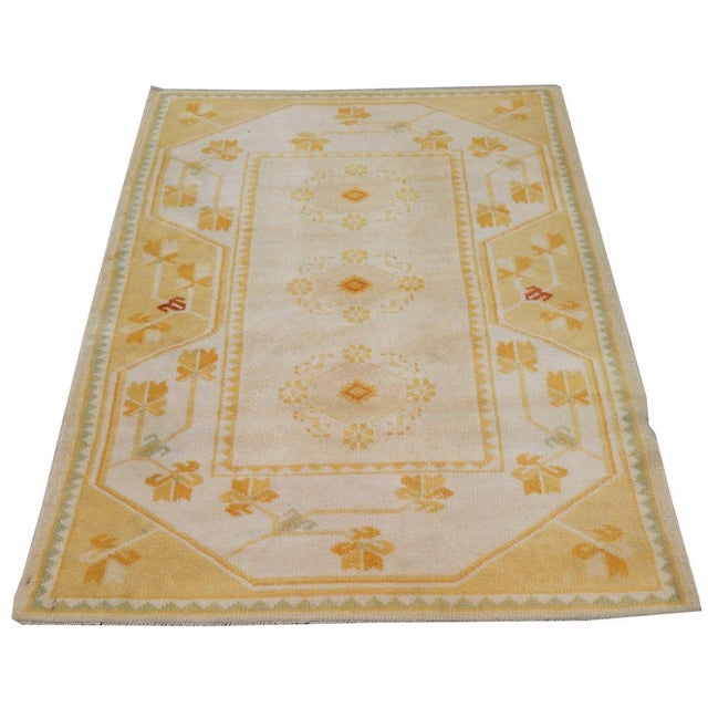 Hand-knotted with care using traditional rug-making techniques, this wool rug blends timeless craftsmanship with a modern...