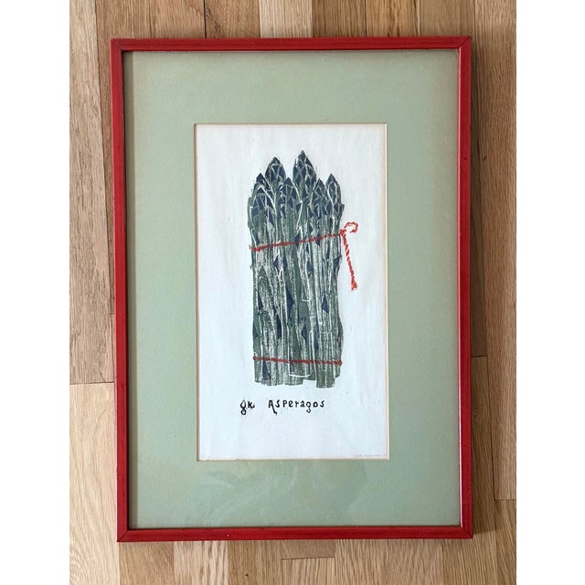 Vintage limited edition woodblock print of asparagus tied with red twine framed in a red wood frame and green mat. Signed...