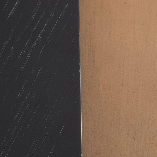 We played with finish and scale to give these geometric wooden tables an element of intrigue. Featuring one ebony stained...