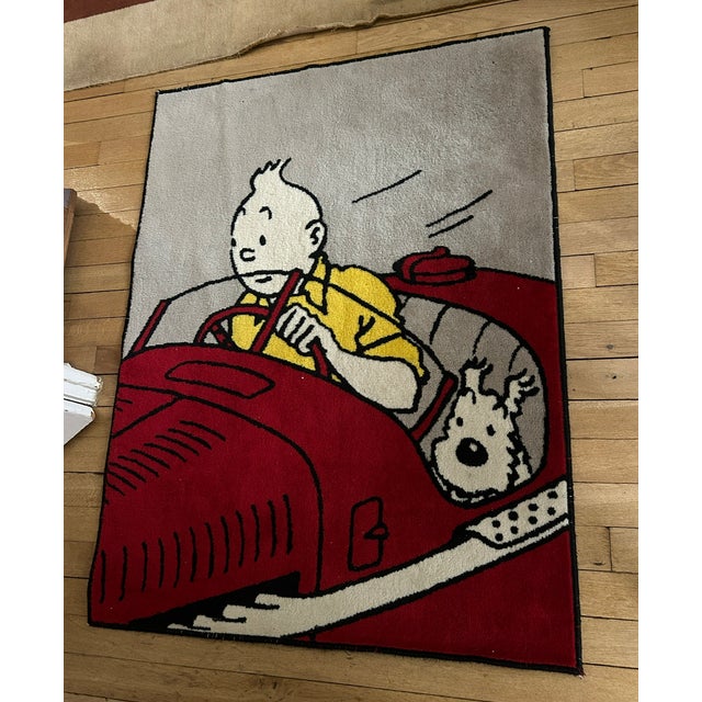 Large rug 100 x 130 cm, Axis edition from 1994, featuring Tintin and Snowy "The Amilcar" by Hergé. Rug in good condition,...