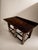 This exceptional and highly characterful console table is crafted from solid oak, boasting an incredibly deep, rich...
