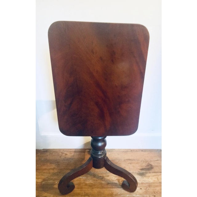 Constructed, circa 1820, in Baltimore and constructed of beautifully figured solid crotch mahogany, this candle stand...