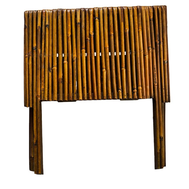 Charming vintage bamboo folding magazine rack featuring a unique X-shaped design with a slatted bamboo construction and...