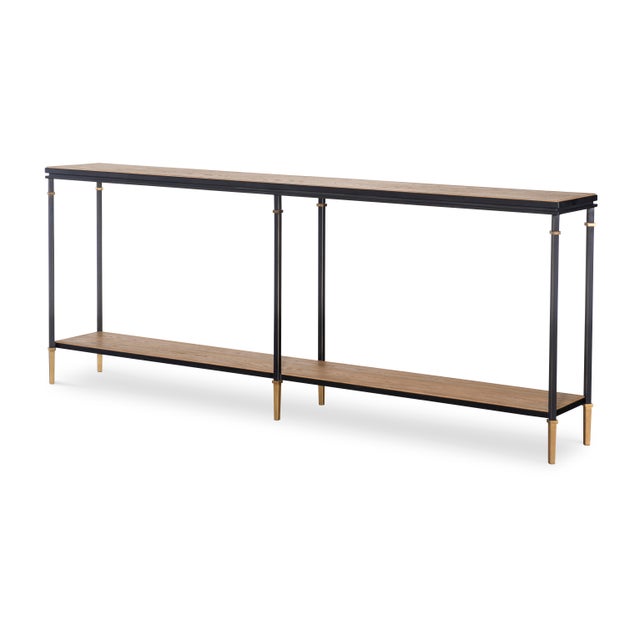 Introduce a touch of modern elegance to your entryway or living space with this oak and bronze metal console table. The...