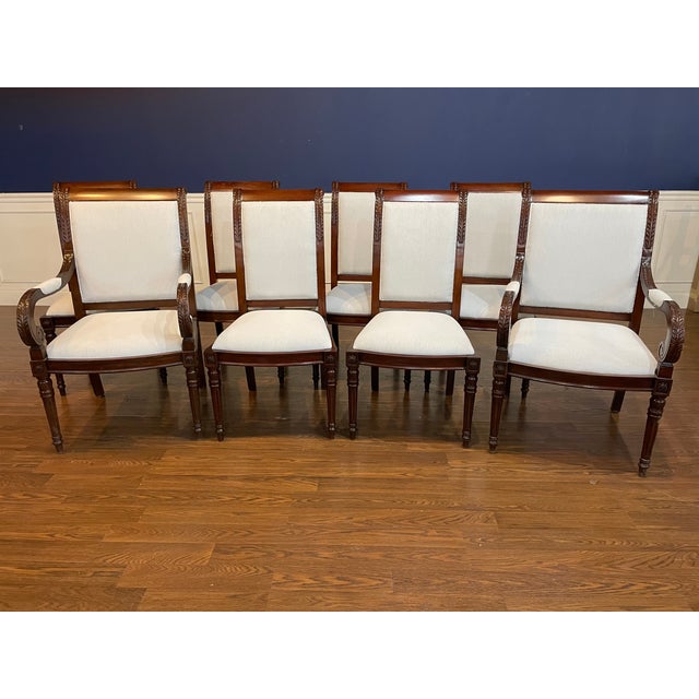 This is a set of eight ( 2 arms and 6 sides) Newport mahogany dining chairs by Leighton Hall. They feature acanthus leaf...