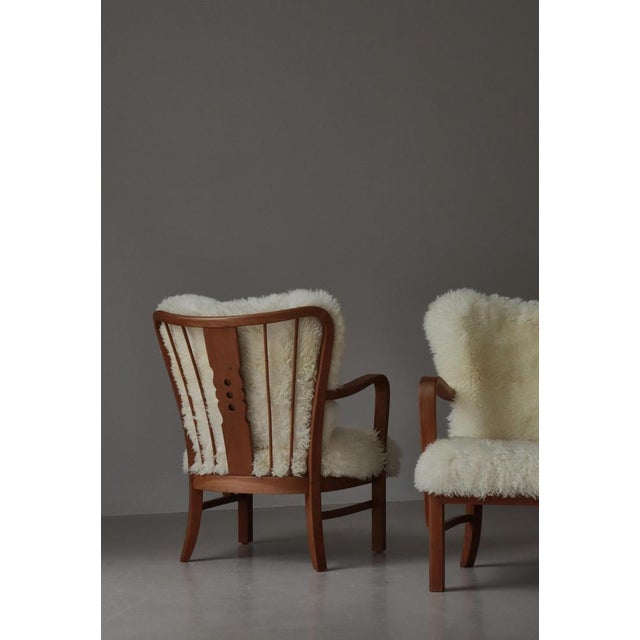 Exceptional and highly sculptural pair of Fritz Hansen lounge chairs, model No. 1588, designed and produced in Denmark...