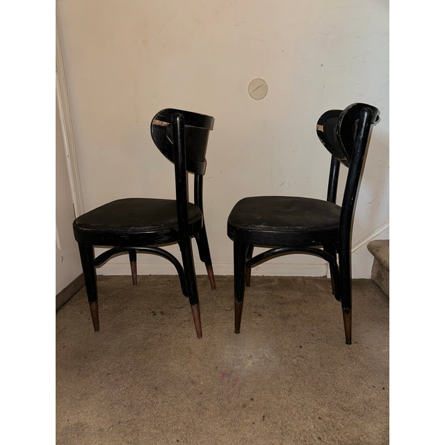 A handsome pair of mid-century modern bentwood café dining chairs manufactured by ZPM Radomsko in Poland, circa...