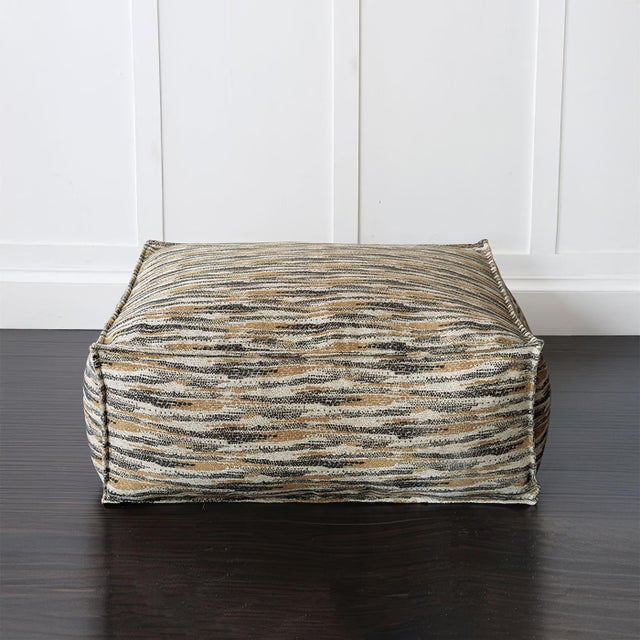 Featuring a woven chenille fabric cover with an intricate pattern inspired by desert landscapes, this oversized pouf adds...