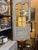 French Blue/Gray Painted cabinet. Two pieces and crown comes off. Inside is original brown oak. Please note is does have...