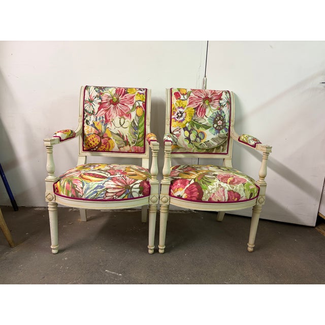 Re-upholsetered ivory directoire style french chairs. The raspberry piping mirrors the beautiful abstract painted like...