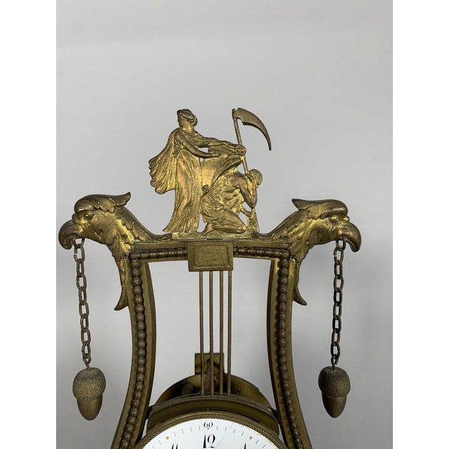 Louis XVI period skeleton clock. French work, circa 1760. Visible mechanism. The clock is in the form of a harp surmounted...