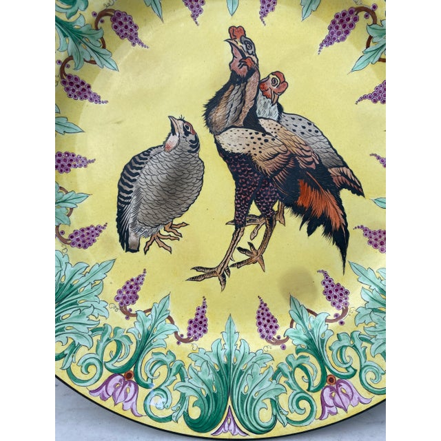 Early French polychrome platter with roosters signed Choisy le roi, circa 1840. The platter edge area is decorated with...