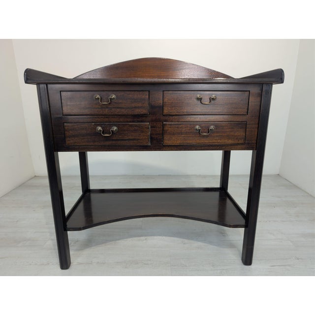 Mahogany Wooden Desk with Brass Handles from the 1960s/1970s This mahogany wooden desk from the 1960s/1970s features four...