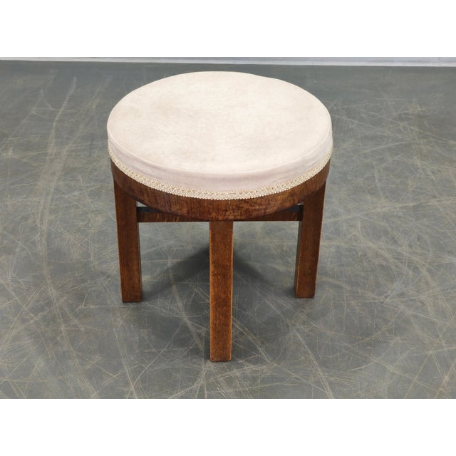 Elegant Art Deco stool produced in Czechoslovakia during the 1930s. This refined vintage seating piece features a solid...