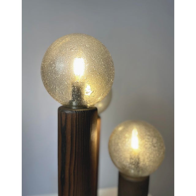 A striking mid-century design piece, this temde leuchten model 19 table lamp combines warm wood craftsmanship with...