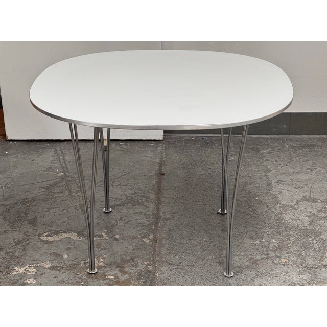 Design Plus Gallery presents the Supercircular Dining Table by Piet Hein & Bruno Mathsson from Fritz Hansen. Originally...