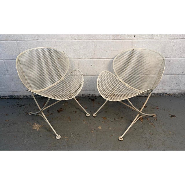 Iconic pair of mid-century modern Italian outdoor chairs designed by Tempestini and manufactured by Salterini. Featuring...