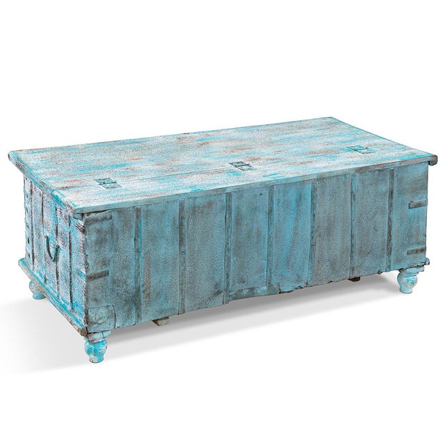 Discover the timeless appeal of this authentic vintage Indian storage chest, a masterpiece of traditional craftsmanship...