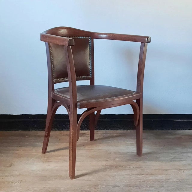 This chair is in original condition. Marked with a metal plate "W. Baumann". This piece has an attribution mark, I am sure...