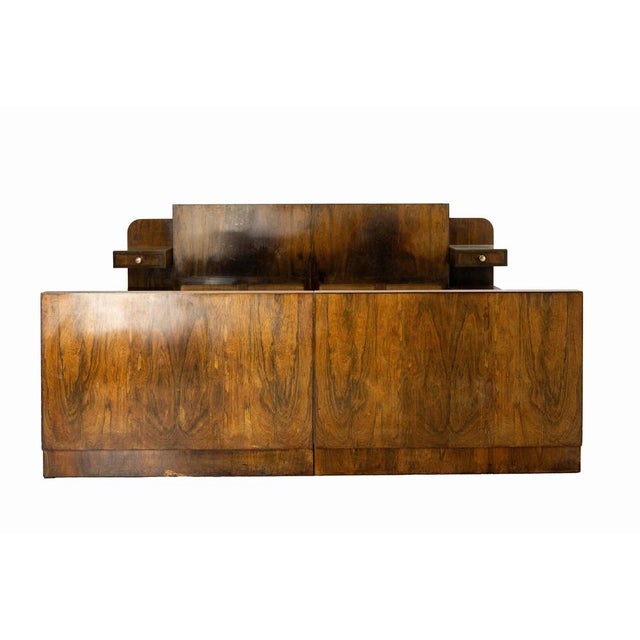 French bed made circa 1930, in the art deco period and style. The bedside cabinets are integrated into the headboard: each...