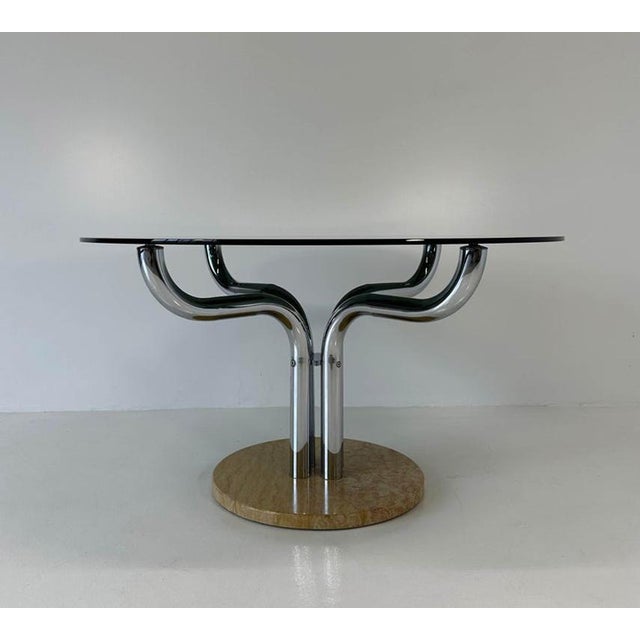Elegant Italian vintage dining table produced in the 1970s and attributable to Guido Faleschini. The piece features a...