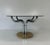 Elegant Italian vintage dining table produced in the 1970s and attributable to Guido Faleschini. The piece features a...