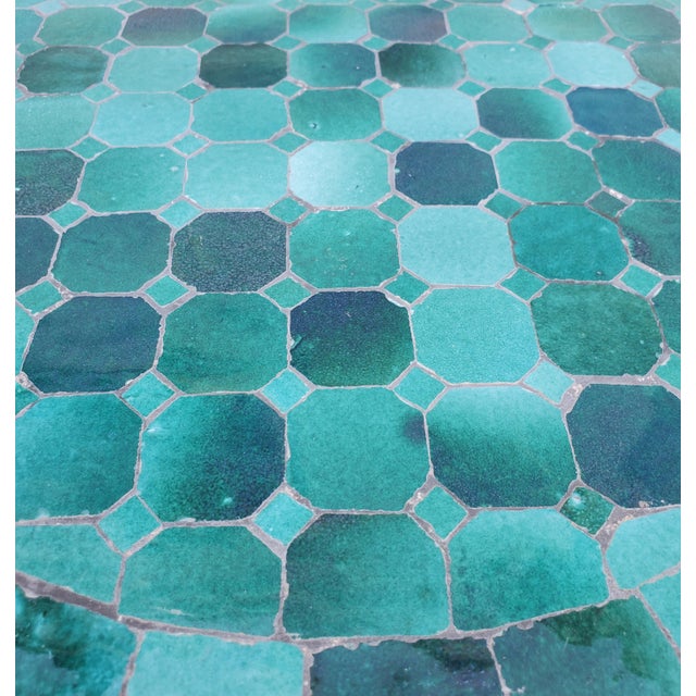 Aqua Blue Mini Moroccan Mosaic table, measuring 16" in diameter, and 18" in height. Comes with a wrought iron folding...