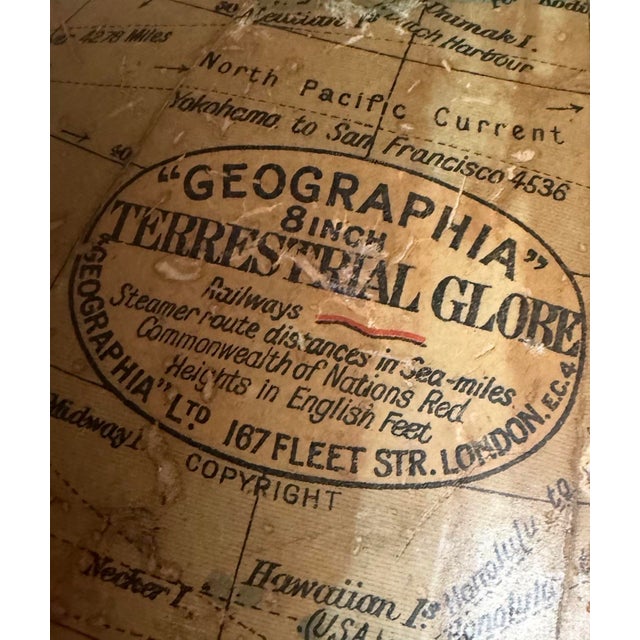 Vintage English terrestrial desk globe by Geographia Ltd., London, featuring an 8-inch lithographed globe mounted in a...