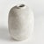 In a textured cold finish, this rotund shaped vase adds a touch of antiquity. Add a few faux stems or branches for color...