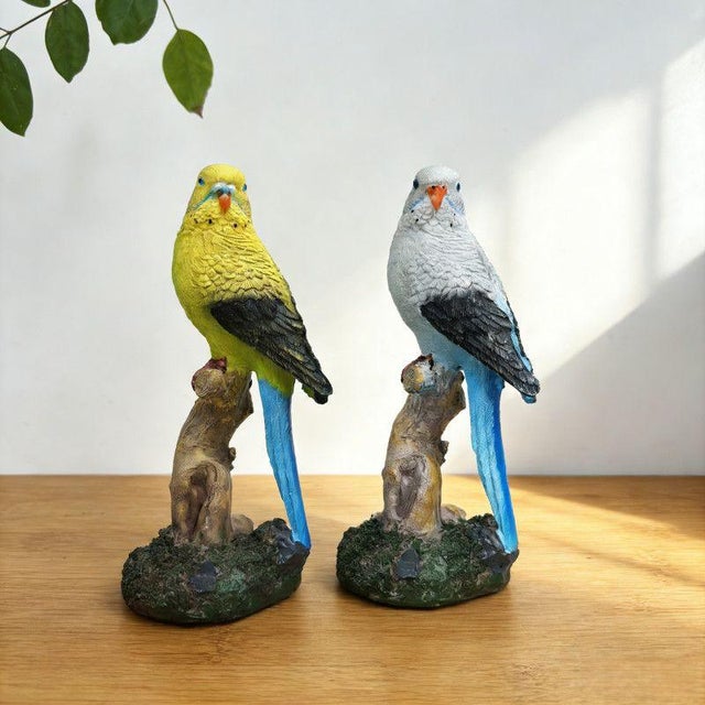 This charming pair of realistic parakeet figurines brings a touch of nature and color to any interior or garden space....