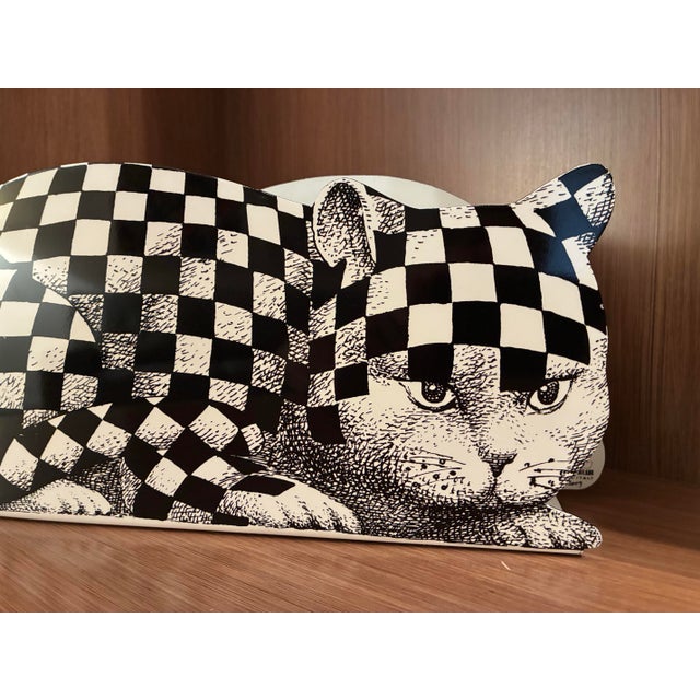 This is a Fornasetti-Milano Magazine Rack Made in Italy. Fornasetti furniture and decor are known for floating between...