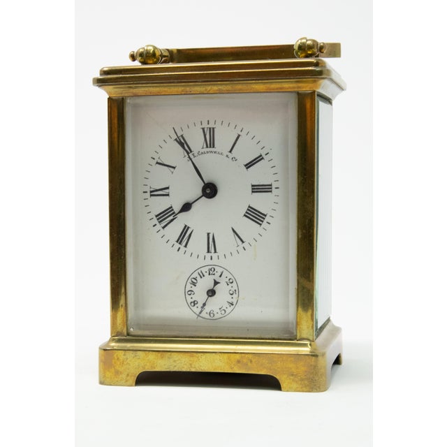 Offering this magnificent Carriage clock by JE Caldwell & Co. Stands on a bracketed foot with beveled glass all around....