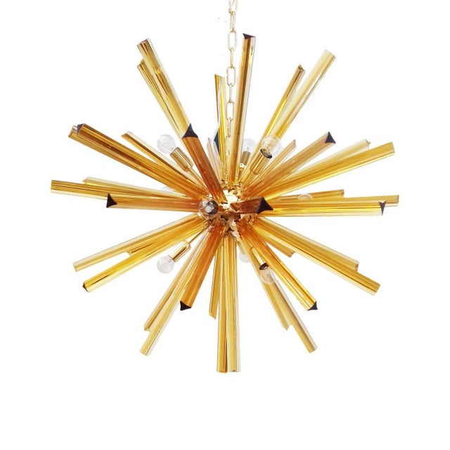 Contemporary Sputnik amber triedro Murano glass chandelier. For Bright and lively interiors. Metal frame in 24K Gold...