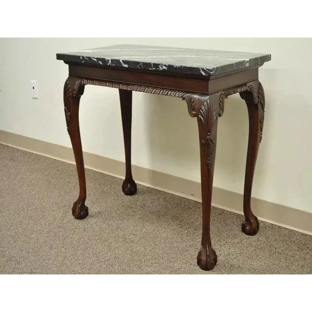 Vintage Mahogany Chippendale Style Ball and Claw Marble Top Console Hall Table. Item features black/white/grey marble top...