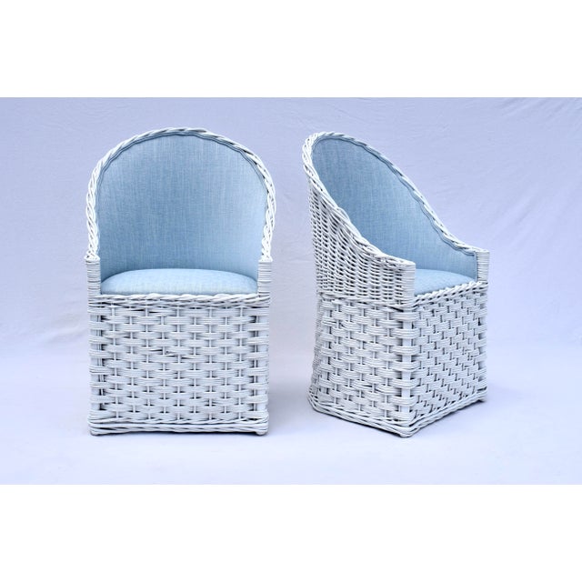 A very sweet pair of vintage Wicker Works white patio or garden chairs newly upholstered in soft blue cotton linen....