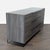 This Modrest dresser features a sleek gray wood finish and black metal legs. It offers six spacious drawers for easy and...