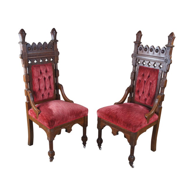 Pair of antique Victorian Gothic Style highback throne chairs. Features a walnut frame with pierced and carved back,...