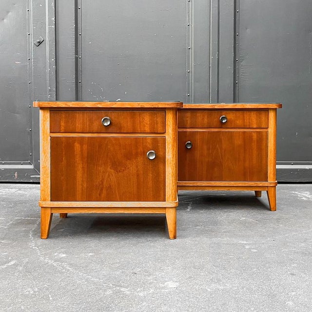 Pair of bedside tables. Style. Mid-century, 1960s. Material. Oak and walnut veneer, glass top. Features. One drawer and...