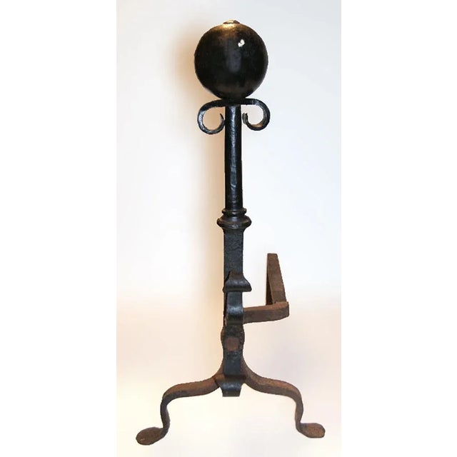 Antique early 20th century cast and wrought iron andirons. Scroll and ball finials with collared shafts. Circa 1900.