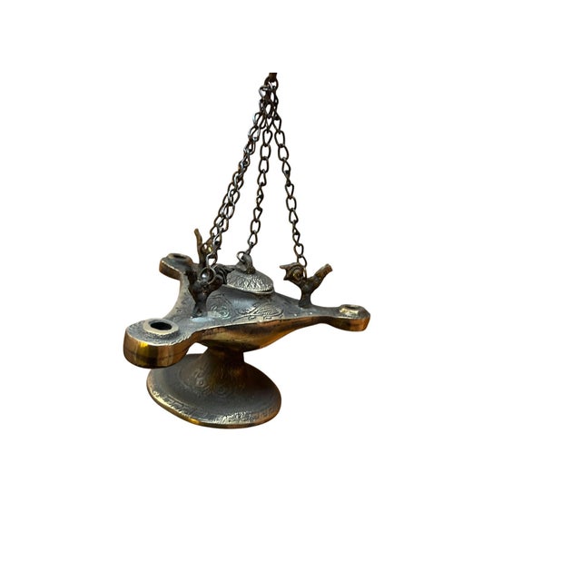 Transform your home into a sanctuary with this intricate Brass Hanging Incense Burner. Modeled after ancient oil lamps,...