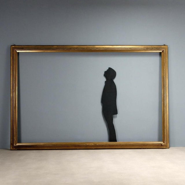 Large Art Deco frame. Decorated in the style of the period and silvered. This piece is attributed to the mentioned...