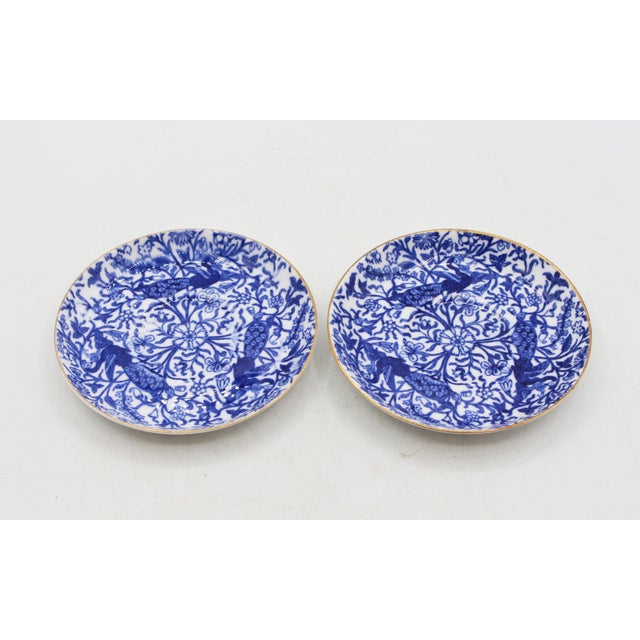 A pair of demitasse cups & saucer by Royal Crown Derby, 1878-1890. Peacock pattern; blue underglaze marks. 18th century...