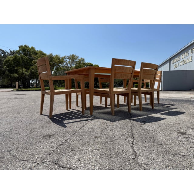 Elevate your outdoor living space with this exceptional, authentic 7-piece Mission Teak dining set by luxury outdoor...